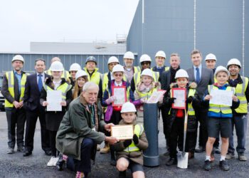 Burying history! Schoolchildren bury time capsule at campus site
