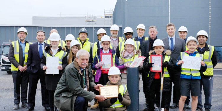 Burying history! Schoolchildren bury time capsule at campus site