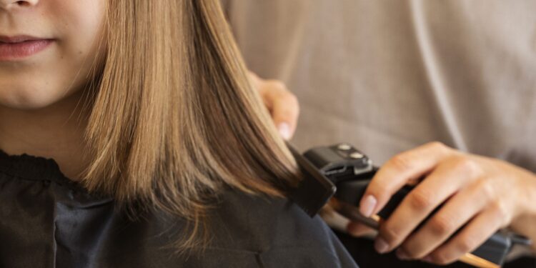 Melksham girl lops off locks for childhood cancer charity