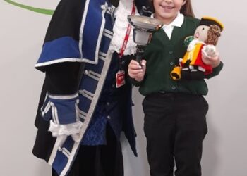 Town crier presents special gift to aspiring local girl