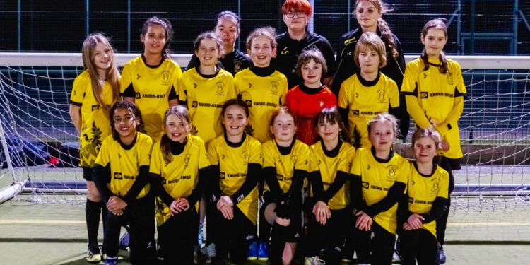 Girls’ football team ‘go the extra mile’ for local charity