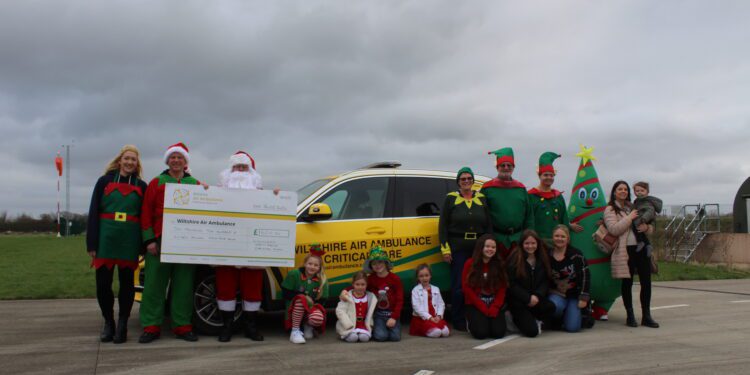 Residents of Sarum Avenue present cheque for over £6,000 to Wiltshire Air Ambulance